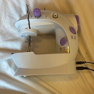 Compact White and Purple Sewing Machine